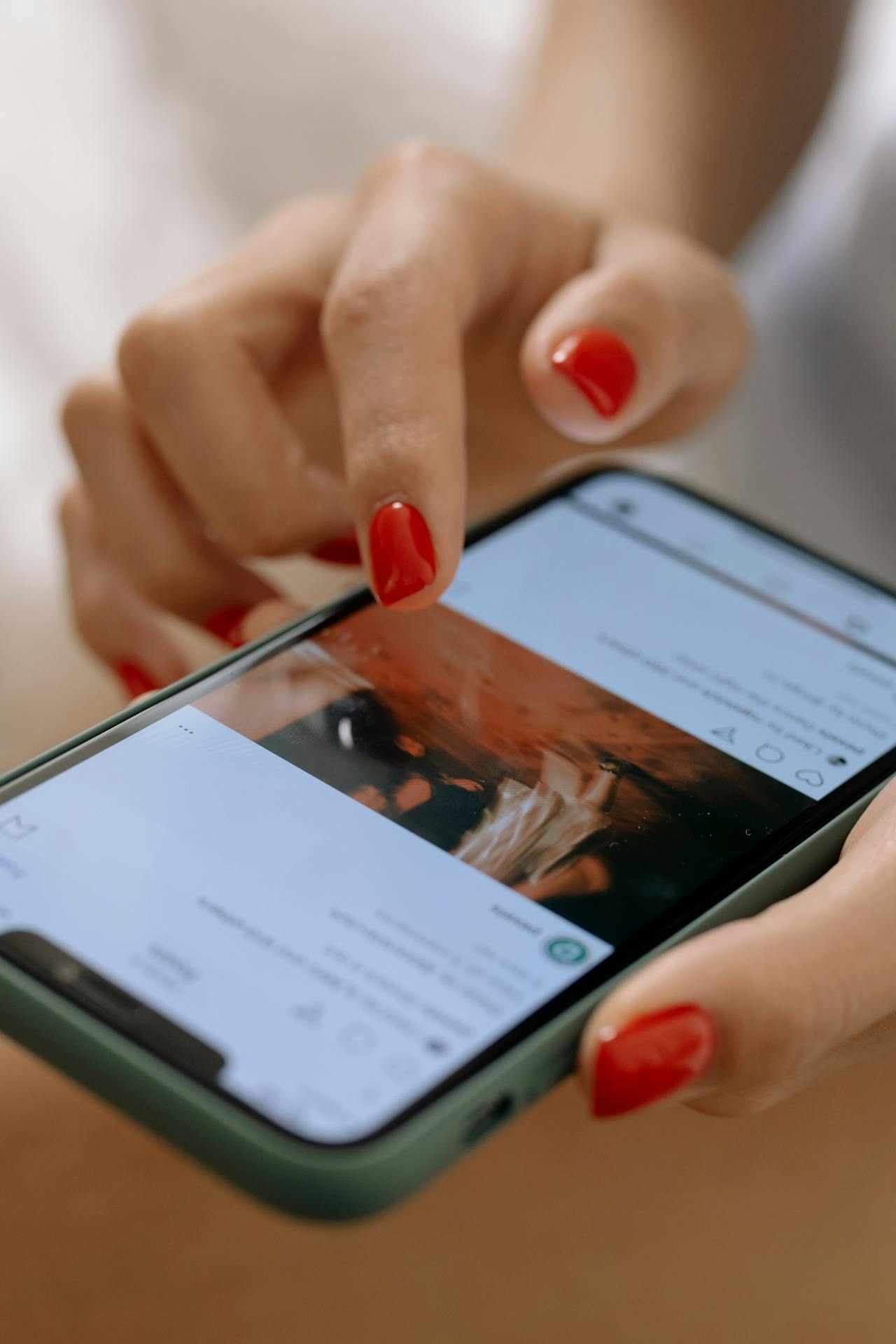 Smartphone with Instagram app open, displaying interactions on business and personal profiles, showcasing tips to boost brand.